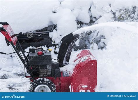 Red Snowblower Clearing A Driveway Stock Photo Image Of Snow Blower