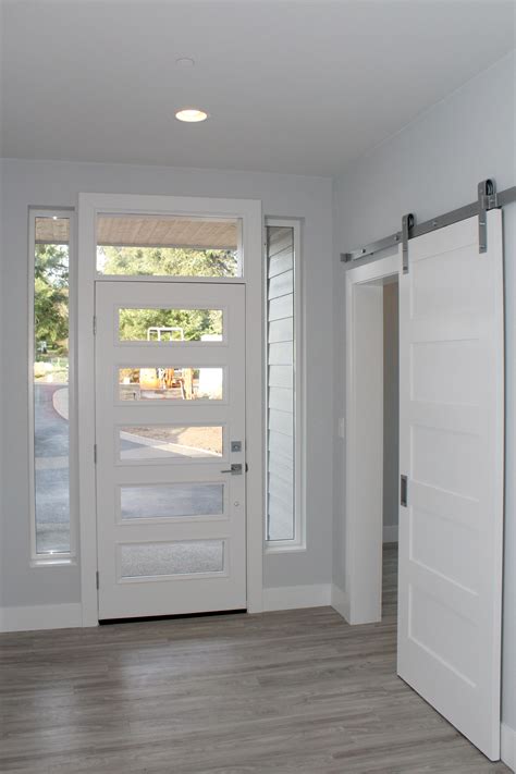 It is an incredibly simple design that works beautifully in any style. Entry door (coded 2585) with sidelights and toplight, barn ...