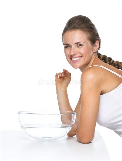 Portrait Of Happy Young Woman And Glass Bowl With Water Stock Image