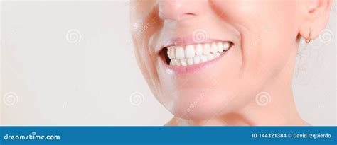 Mature Woman Showing Perfect Natural White Teeth On The Side Stock