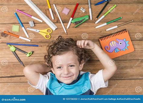 Child Surrounded By School Supplies Stock Photo Image Of Equipment