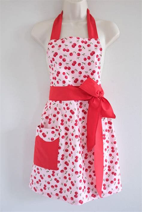 a white and red apron on a mannequin with polka dot print bow tie around the neck