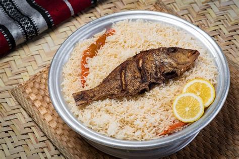 Premium Photo Arabian Sheri Fish Mandi Rice With Lemon Slice Served