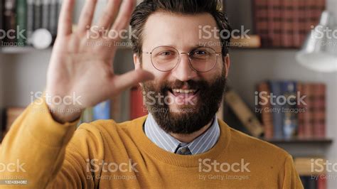 Man Waving Hello Positive Smiling Laughing Man In Office Or Apartment