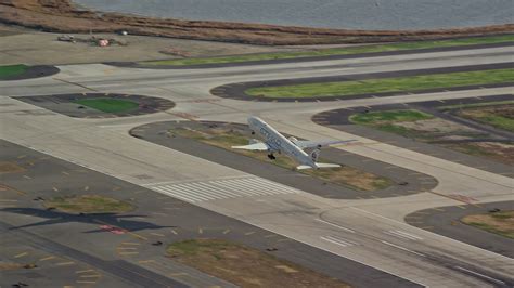 55k Stock Footage Aerial Video Of An Airliner Cruising Down Runway At