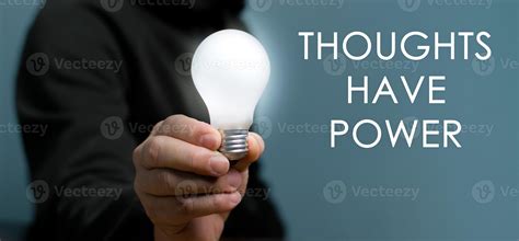 Hand Holding Light Bulb With Text Thoughts Have Power The Power Of
