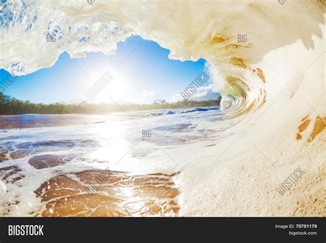 Sandy Ocean Wave Crashing Onto The Beach Stock Photo And Stock Images