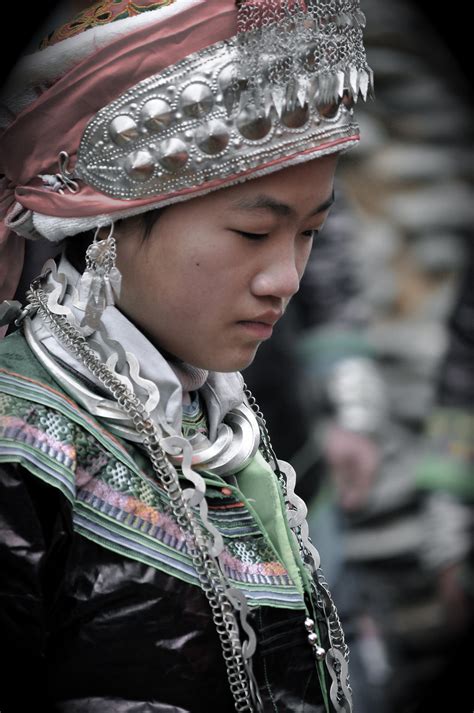 A Miao/Hmong girl dressed in traditional clothing for a winter festival ...