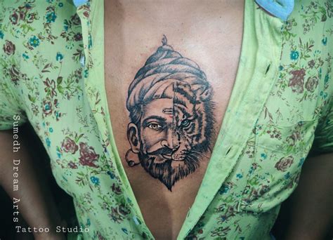 A Woman With A Tiger Tattoo On Her Chest