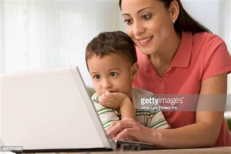 Mom Sits On Sons Lap Photos And Premium High Res Pictures Getty Images