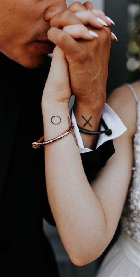 Find and save ideas about matching couples on pinterest. Cute Matching Couple Tattoo Ideas - Small XO Wrist ...