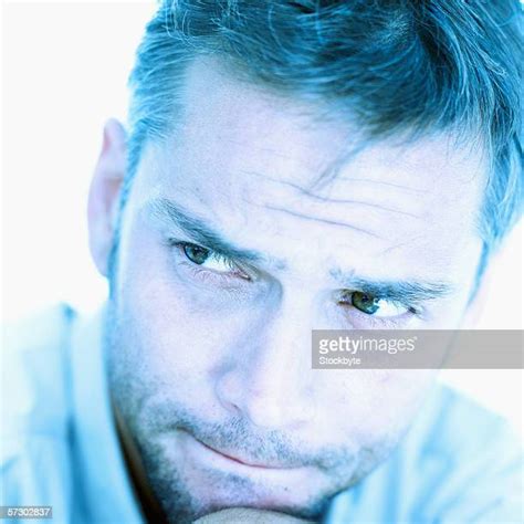 Man Biting Lip Close Up Photos And Premium High Res Pictures Getty Images
