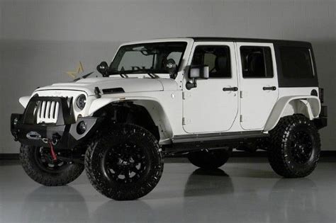 White Jk Unlimited With Custom Front Bumper Fender Flares And Tires