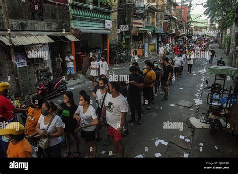 Voters Endure Long Lines Outside Tondo High School In Tondo Manila