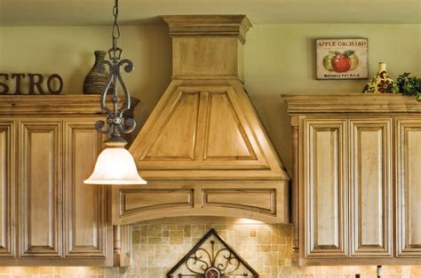 Your range hood should ventilate vertically, meaning through the ceiling and roof, or horizontally, meaning through a side wall. Wood Vent Hood That You Might Want to See - HomesFeed