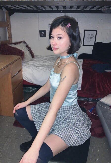 Adorable Asian College Freshman Posing In A Schoolgirl Skirt With Black