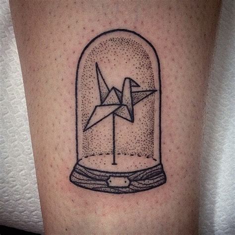 Homemade Like Black Ink Bid Shaped Paper Toy Under The Glass Tattoo On