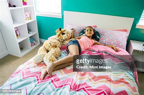 Tween Girl Relaxing On Her Bed In Her Bedroom Bildbanksbilder Getty