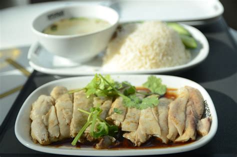 According to wikipedia, hainanese chicken rice originated in hainan, but then grew so popular in singapore that it became one of their national dishes. Hainanese Chicken Rice: a Very Detailed Recipe