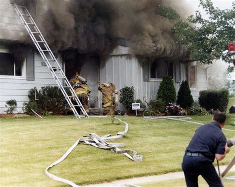 Firefighters Prepare To Enter A Burning House Editorial Image Image