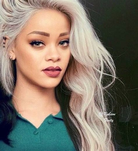 Curly medium blonde hair with extra bounce and heavy bangs floating on the front. rihanna with grey hair | Rihanna hairstyles, Hair styles ...