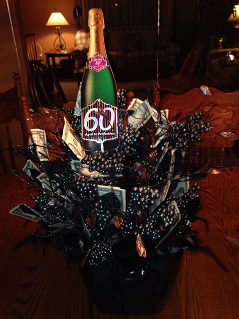 60th Birthday Party Centerpiece Has 60 Worth Of 2 Bills Stuck In It