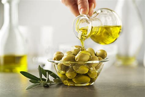 Olive Oil Bottle Pouring To Bowl Close Up Stock Image Image Of
