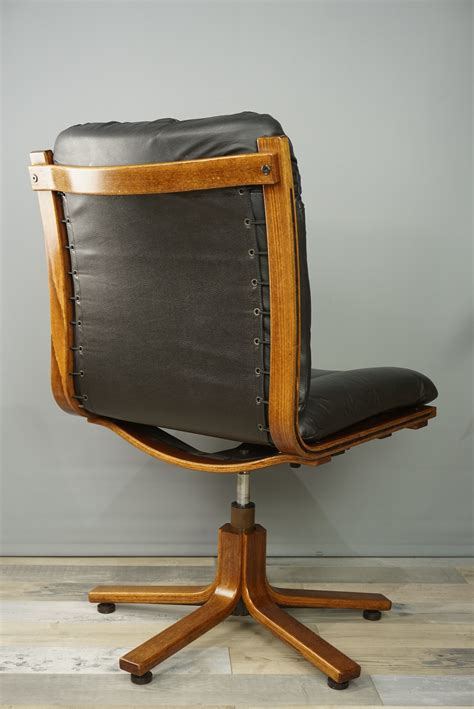 Shop with afterpay on eligible items. Vintage swivel office chair in wood and leather - 1970s ...