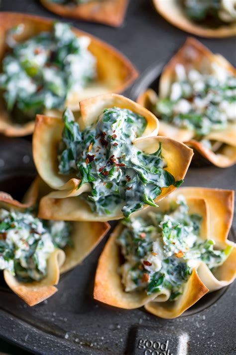 These parmesan wonton chips are a great quick snack made with wonton wrappers, extra virgin olive oil, basil or rosemary. Speedy Spanakopita Wonton Cups with Spinach and Feta | Recipe in 2020 | Spinach and feta, Wonton ...