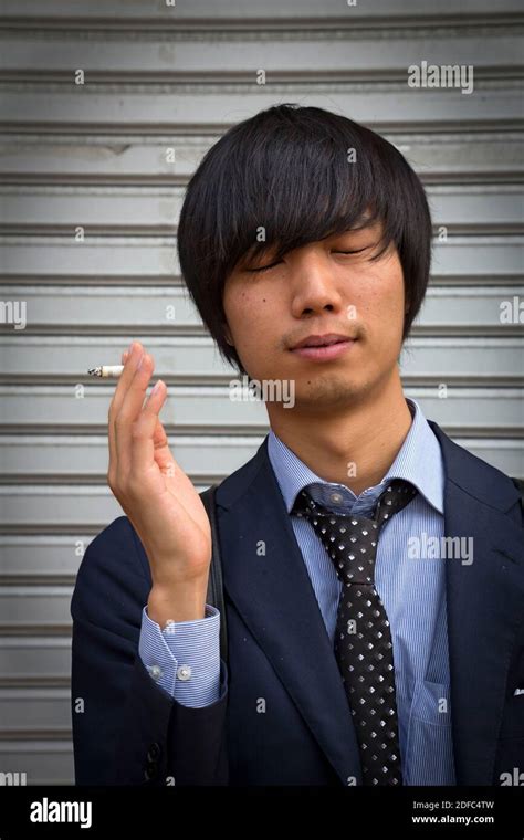 Japan Japanese Man Smoking In Osaka Stock Photo Alamy