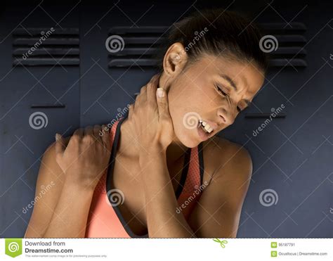 Attractive Hispanic Fitness Woman Touching And Grabbing Her Neck Stock Image Image Of Hand