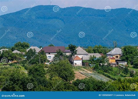 A Small Rural Village Is Located In A Cozy Distance From The Green