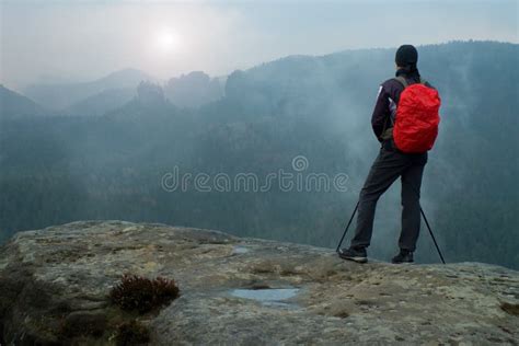 Hiker With Red Backpack On Sharp Sandstone Rock In Rock Empires Park