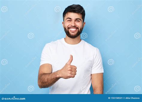 Happy Bearded Man In Stylish White T Shirt With Beaming Smile Showing