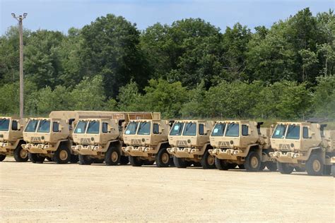 Military Vehicles Are Lined Up At A Staging Area On Nara And Dvids