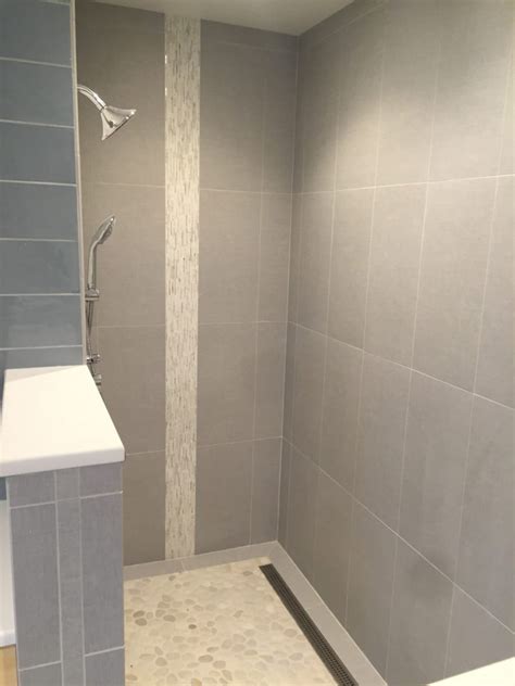 Lines create patterns that can either enhance or detract from the. large 12x24 tile on shower wall with vertical AKDO heavy ...