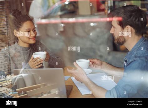 Mixed Races Couple At Business Meeting Talking And Drinking Coffee Man