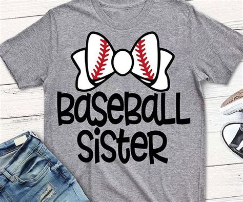 A T Shirt With The Words Baseball Sister On It And A Pair Of Denim Shorts