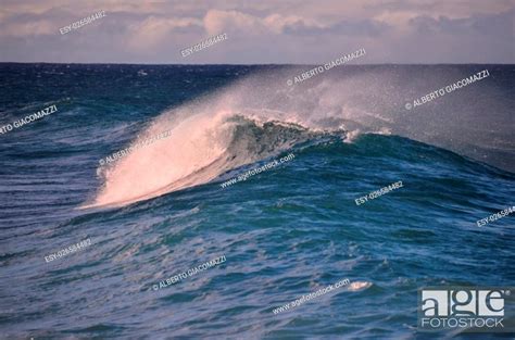 Big Blue Wave Breaks In The Atlantic Ocean Stock Photo Picture And