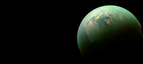 Titan, moon of saturn, photographed by voyager 2 on august 25, 1981, at a distance of 907,000 km (564,000 miles). Sunlight Reflecting Off The Hydrocarbon Seas Of Saturn's ...