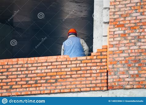 View Of Mason Laying Bricks At Construction Site Stock Photo Image Of