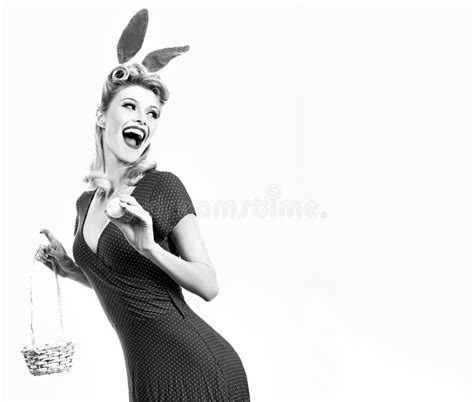 woman wearing a mask easter bunny and looks very sensually model dressed in costume easter
