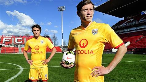 Football(soccer) logo adelaide united f.c. Adelaide United unveils yellow strip for clash against ...