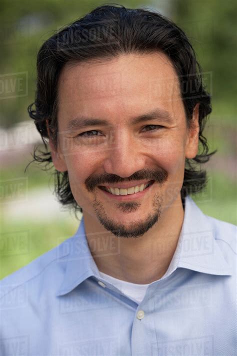 Close Up Of Smiling Mixed Race Man Stock Photo Dissolve