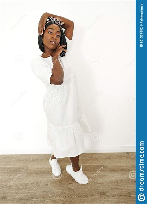 Beautiful Young African Woman Posing Over White Background Stock Photo