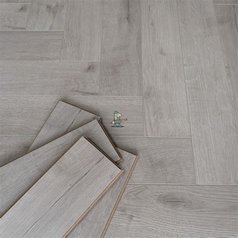 Fusion Herringbone 12mm Embossed Grey Oak 4v Laminate Flooring