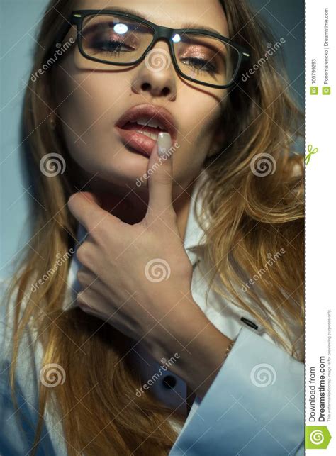 vertical portrait of blonde in sunglasses licks her finger on camera stock image image of