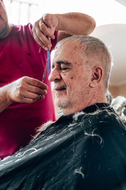 Premium Photo Old Man Getting A Haircut