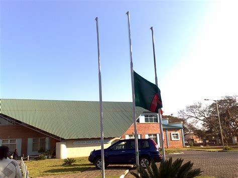 The base of a flag of zambia, which has been adopted in 1964, is composed of a green leaf. File:Zambia flag at half-mast.jpg - Wikimedia Commons