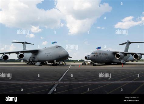 A C 5m Super Galaxy And C 17 Globemaster Iii Sits On The Flight Line